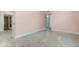 Spacious bedroom with neutral paint, baseboard trim, and a large doorway at 3972 Poinsettia Ave, Mount Dora, FL 32757