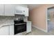A modern kitchen featuring an elegant electric range oven and matching marble countertops at 3972 Poinsettia Ave, Mount Dora, FL 32757