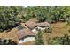 Aerial view showcasing house and detached garage at 40325 Emeralda Island Rd, Leesburg, FL 34788