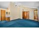 Large bedroom with vaulted ceiling, ceiling fan, and en-suite bathroom at 40325 Emeralda Island Rd, Leesburg, FL 34788