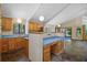 Bright kitchen with wood cabinets, ample counter space, and unique design at 40325 Emeralda Island Rd, Leesburg, FL 34788
