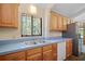 Well-lit kitchen area with modern appliances, wood cabinetry and plenty of counter space at 40325 Emeralda Island Rd, Leesburg, FL 34788