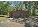 Utility shed with secure door and window offering secure storage for the homeowner at 40325 Emeralda Island Rd, Leesburg, FL 34788