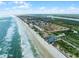 Coastal view of beachfront condos, ocean, and surrounding community at 4435 S Atlantic Ave # 114, Ponce Inlet, FL 32127
