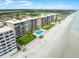 Beachfront condos offering a pool, lush lawn, and direct beach access at 4435 S Atlantic Ave # 114, Ponce Inlet, FL 32127