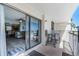 Balcony with tiled flooring, seating, and sliding glass doors to the interior living area at 4435 S Atlantic Ave # 114, Ponce Inlet, FL 32127