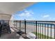 Balcony with seating overlooking a pool and the ocean beyond at 4435 S Atlantic Ave # 114, Ponce Inlet, FL 32127
