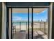 Balcony view overlooking the pool and ocean, perfect for relaxation and enjoying the coastal breeze at 4435 S Atlantic Ave # 114, Ponce Inlet, FL 32127