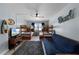 Inviting bedroom with bunk beds, futon, and TV, with beach decor, ideal for relaxation at 4435 S Atlantic Ave # 114, Ponce Inlet, FL 32127