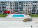 Exterior view of condominium building on the beach with pool and access to individual units at 4435 S Atlantic Ave # 114, Ponce Inlet, FL 32127