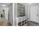 Bright hallway with decorative storage, leading to different rooms in the home at 4435 S Atlantic Ave # 114, Ponce Inlet, FL 32127