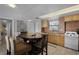 Kitchen with dining area, offering essential amenities and access to other areas of the home at 4435 S Atlantic Ave # 114, Ponce Inlet, FL 32127