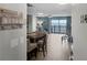 Inviting living area with wood-look tile, a view of oceanfront balcony, and beach decor at 4435 S Atlantic Ave # 114, Ponce Inlet, FL 32127