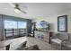 Beautiful living room boasts ocean view, ceiling fan, stylish furniture and wood-look tile flooring at 4435 S Atlantic Ave # 114, Ponce Inlet, FL 32127