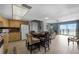 Bright condo living area with ocean view, dining table, and comfortable furnishings at 4435 S Atlantic Ave # 114, Ponce Inlet, FL 32127