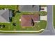 Aerial view of a home with landscaped lawn and neighboring houses at 4671 Spring Grove Ln, Leesburg, FL 34748