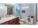 Bathroom with decorative accents, tiled shower, and plenty of storage at 4671 Spring Grove Ln, Leesburg, FL 34748