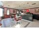 Retro-style cafe with red and white striped walls, classic diner tables, and a charming vintage ambiance at 4671 Spring Grove Ln, Leesburg, FL 34748