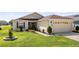 Charming home with manicured landscaping, and a spacious driveway at 4671 Spring Grove Ln, Leesburg, FL 34748