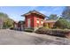 Attractive community building with a unique tower feature, stone accents, and well-maintained landscaping at 4671 Spring Grove Ln, Leesburg, FL 34748