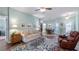 Bright living room with a ceiling fan, comfortable furniture, and stylish decor at 4671 Spring Grove Ln, Leesburg, FL 34748