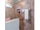 Modern shower with tiled walls, recessed niche, and grab bar at 4671 Spring Grove Ln, Leesburg, FL 34748