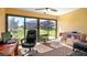 Bright sunroom offering views of the spacious backyard at 4671 Spring Grove Ln, Leesburg, FL 34748