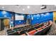Cozy theater room with comfortable seating, a large screen, and themed decor for entertainment at 4671 Spring Grove Ln, Leesburg, FL 34748