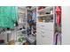 Organized walk-in closet with built in shelving, drawers, and hanging storage at 4671 Spring Grove Ln, Leesburg, FL 34748