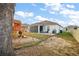 Expansive backyard with playset, a patio seating area, and lush green lawn at 488 Avila Pl, Howey In The Hills, FL 34737