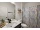 Modern bathroom featuring a vanity with black hardware and a shower with a patterned curtain at 488 Avila Pl, Howey In The Hills, FL 34737