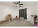 Cozy bedroom with plush carpet, ceiling fan, and playful decor at 488 Avila Pl, Howey In The Hills, FL 34737