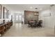 Light and bright dining area with modern decor, stylish lighting, and access to the entryway at 488 Avila Pl, Howey In The Hills, FL 34737