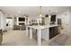 Open floor plan showcases a kitchen with a large island overlooking the living area with fireplace at 488 Avila Pl, Howey In The Hills, FL 34737