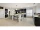 Spacious kitchen features an oversized island with seating, modern appliances, and dark cabinets at 488 Avila Pl, Howey In The Hills, FL 34737