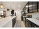 A gourmet kitchen features an island and stainless appliances, complemented by sleek dark cabinetry at 488 Avila Pl, Howey In The Hills, FL 34737