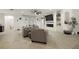Bright living room featuring a modern fireplace, built-in shelves, and comfortable seating at 488 Avila Pl, Howey In The Hills, FL 34737