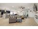 Spacious living room with neutral tones, stylish furnishings and an open flow to the kitchen at 488 Avila Pl, Howey In The Hills, FL 34737