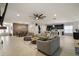 Open-concept living space with dining and seating areas, seamlessly connected to a modern kitchen at 488 Avila Pl, Howey In The Hills, FL 34737