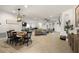 Bright, open-concept living space features dining area, modern lighting and seamless flow to the kitchen at 488 Avila Pl, Howey In The Hills, FL 34737