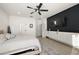 Inviting main bedroom with accent wall, ceiling fan, and ample natural light at 488 Avila Pl, Howey In The Hills, FL 34737