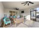 Relaxing screened patio with comfortable seating and a view of the outdoor space at 488 Avila Pl, Howey In The Hills, FL 34737