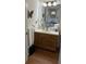 Bathroom with a single sink vanity, neutral countertops, and tile flooring at 4941 Tradition Dr, Lakeland, FL 33812