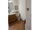 Bathroom featuring a toilet and sink with wooden vanity and accents at 4941 Tradition Dr, Lakeland, FL 33812