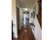 Hallway featuring hardwood floors and a partial view of the stairs at 4941 Tradition Dr, Lakeland, FL 33812