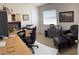 Well-organized office with a desk, chair, and comfortable seating area at 4941 Tradition Dr, Lakeland, FL 33812