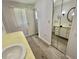 Bathroom with sink and large mirrored cabinet for plenty of storage at 504 Hawthorne Blvd, Leesburg, FL 34748