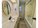 Clean bathroom with tub/shower combo and vanity with ample counter space at 504 Hawthorne Blvd, Leesburg, FL 34748