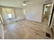 Bright bedroom features light wood floors and a ceiling fan at 504 Hawthorne Blvd, Leesburg, FL 34748