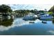 Waterfront boat dock featuring several boats on a sunny day with great reflections at 504 Hawthorne Blvd, Leesburg, FL 34748